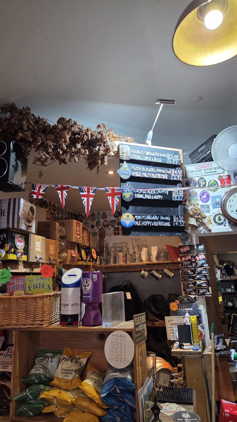 Shelves and bunting inside the pub