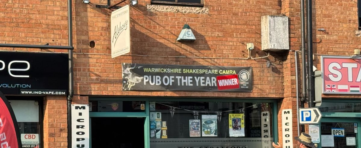 The Stratford Alehouse front, with its hanging sign, a CAMRA Pub of the Year banner and Micropub boards